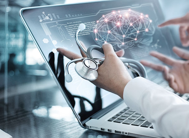 Doctor wearing a white coat and holding a stethoscope while evaluating information on a notebook