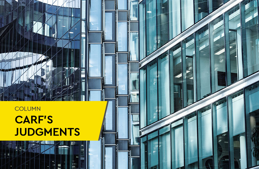 View of two mirrored buildings with blue glazing. In the lower left corner, yellow banner with the words: Carf Judgments Column